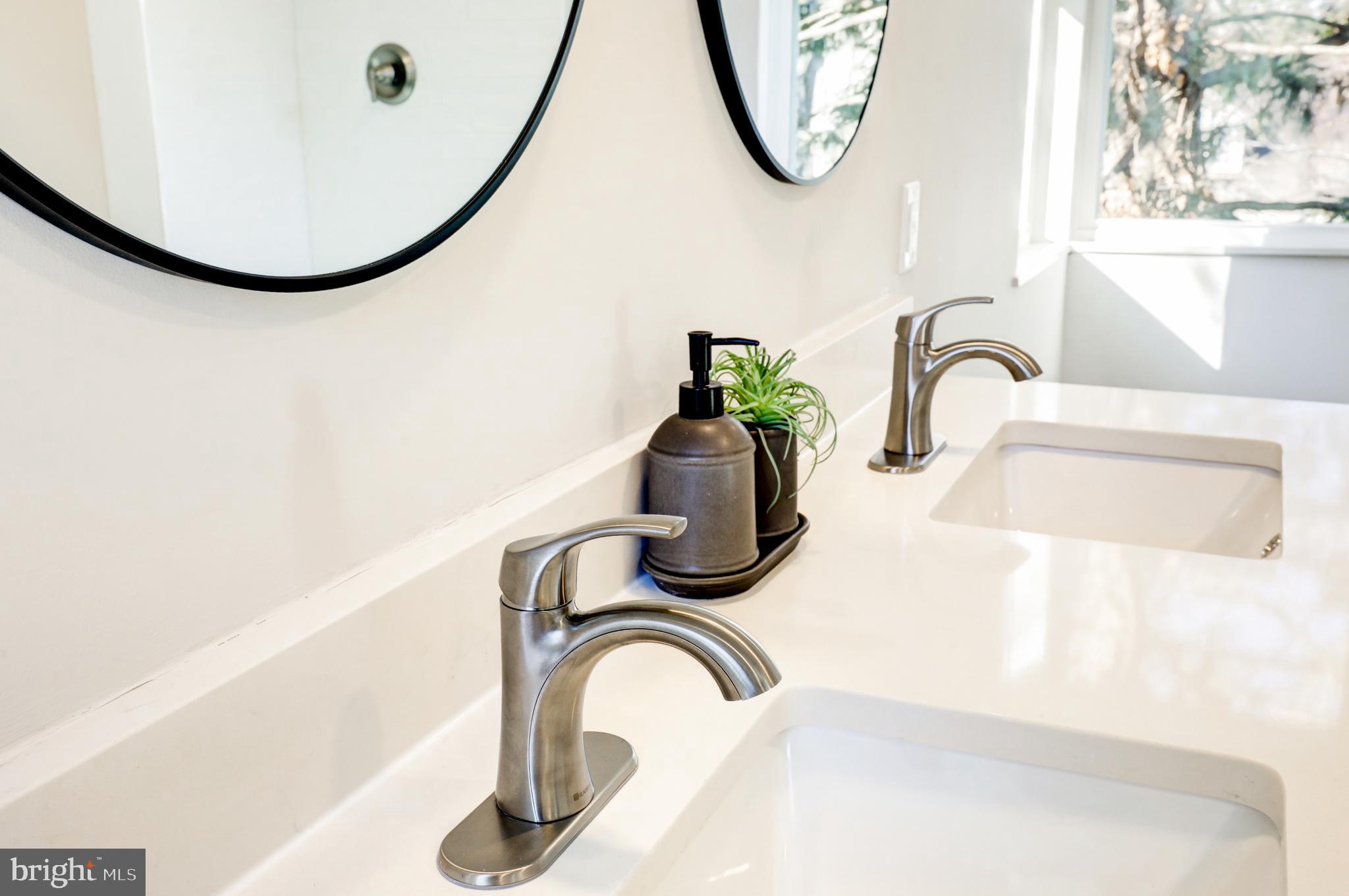 1081 Wynnwood Road Abington, PA 19001 - Photo 32 of 45 a bathroom with a sink and a mirror