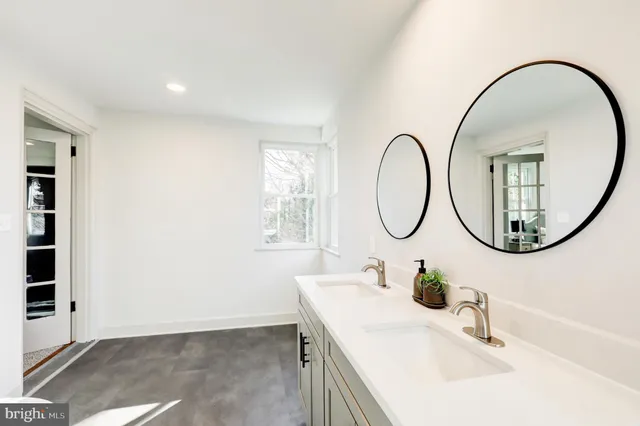 a picture of a bathroom with a sink and a mirror