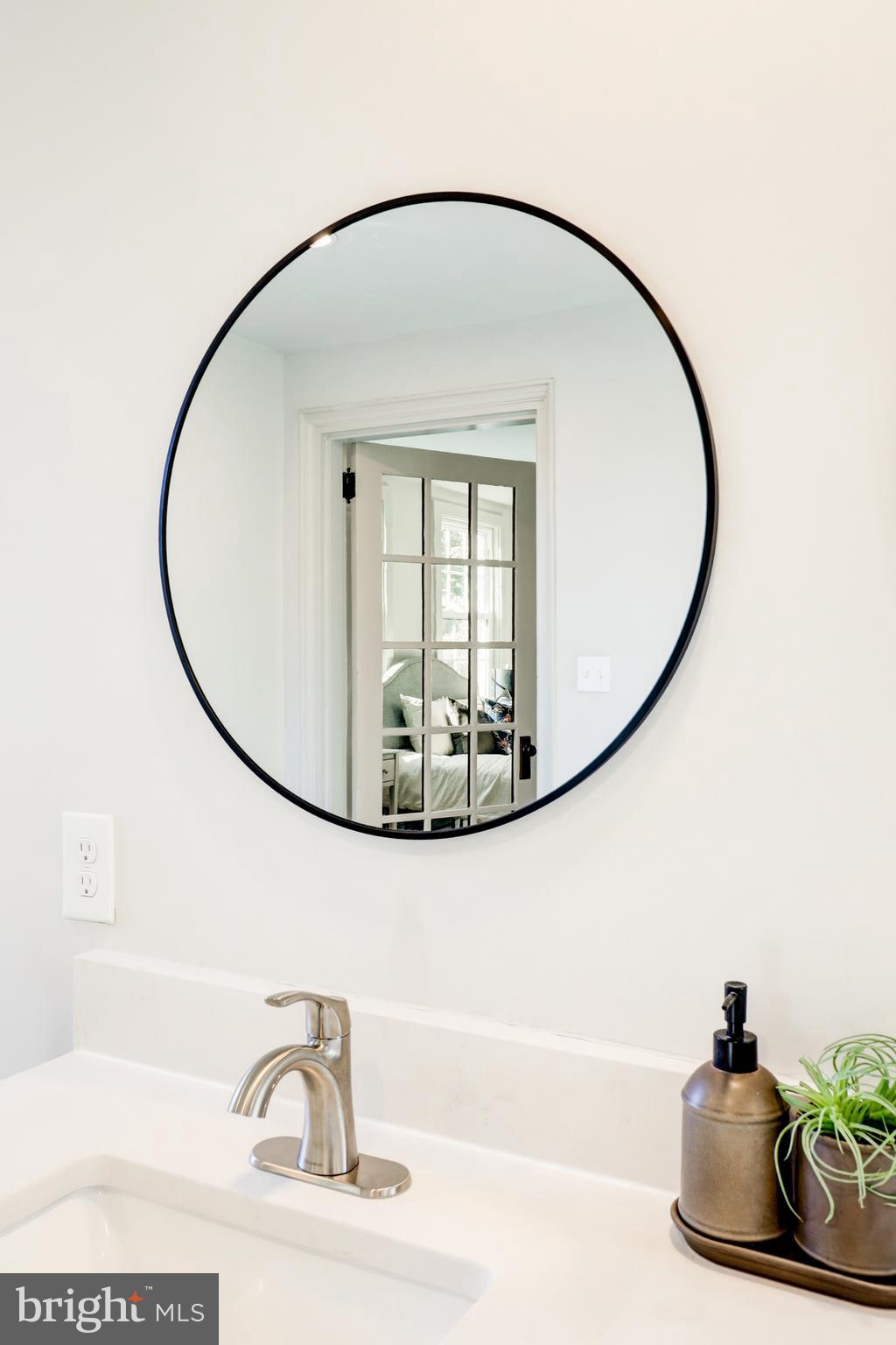 1081 Wynnwood Road Abington, PA 19001 - Photo 35 of 45 a picture of a bathroom with a sink and a mirror
