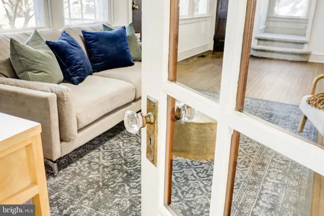 a living room with a couch next to a window
