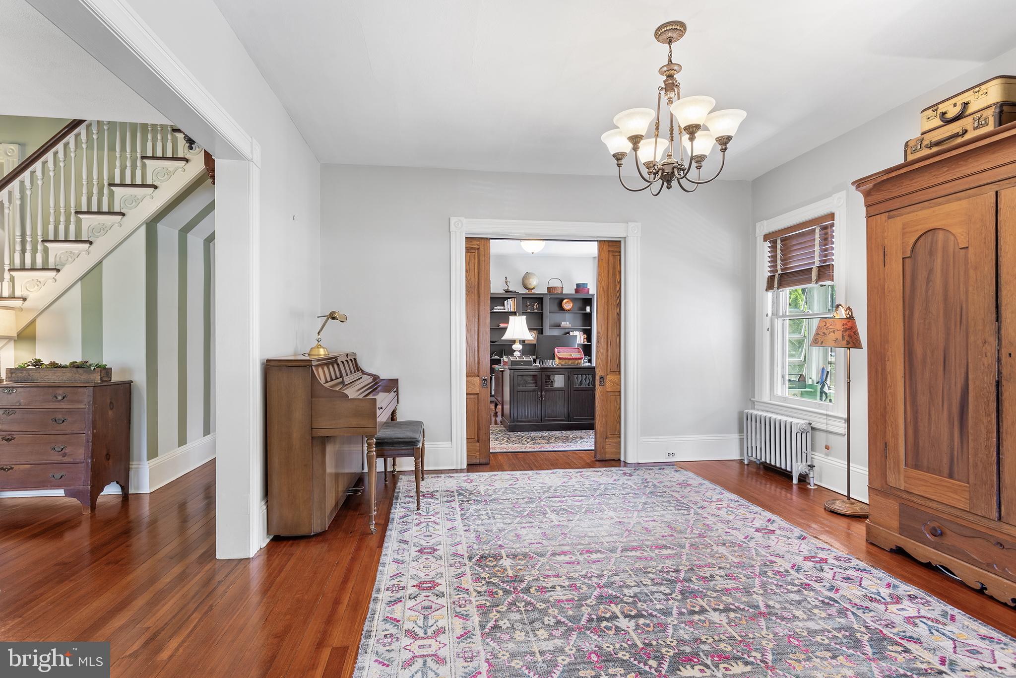 960 Lawrence Road Lawrenceville, NJ 08648 - Photo 12 of 62 a view of a hallway with wooden floor and staircase