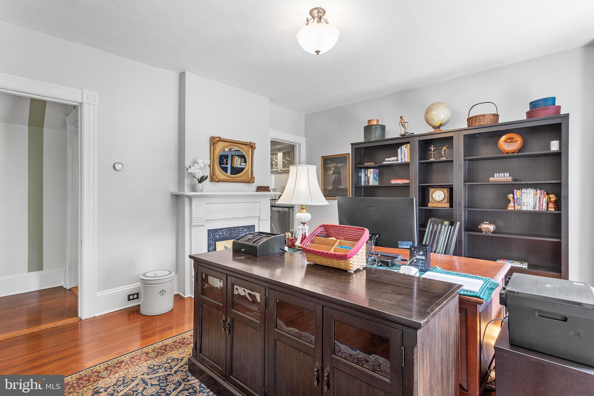 960 Lawrence Road Lawrenceville, NJ 08648 - Photo 14 of 62 a view of a workspace with furniture and wooden floor
