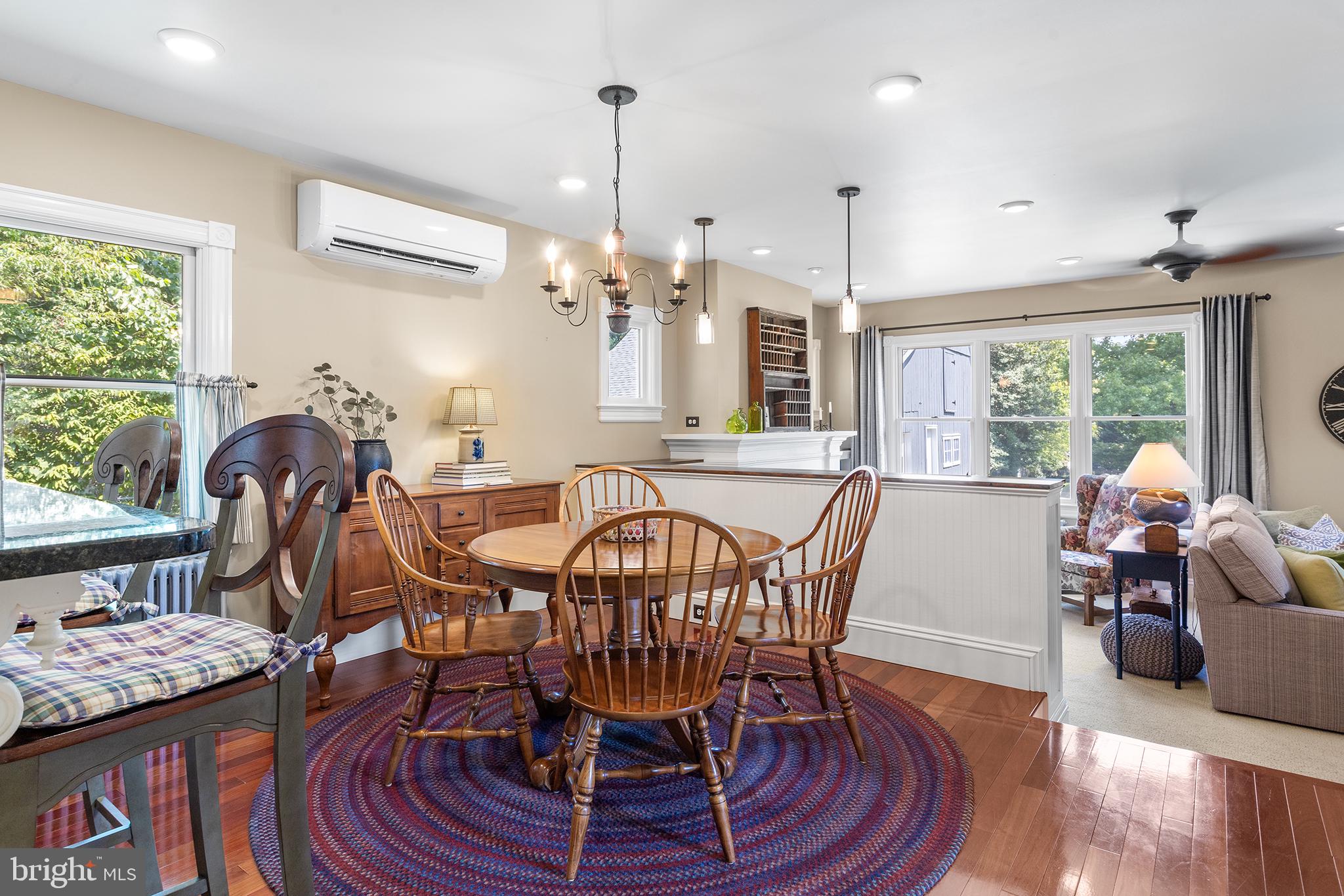 960 Lawrence Road Lawrenceville, NJ 08648 - Photo 23 of 62 a view of a dining room with furniture a chandelier and wooden floor