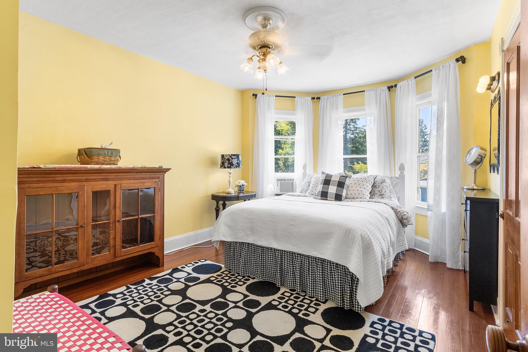 960 Lawrence Road Lawrenceville, NJ 08648 - Photo 39 of 62 a bedroom with a bed and wooden floor