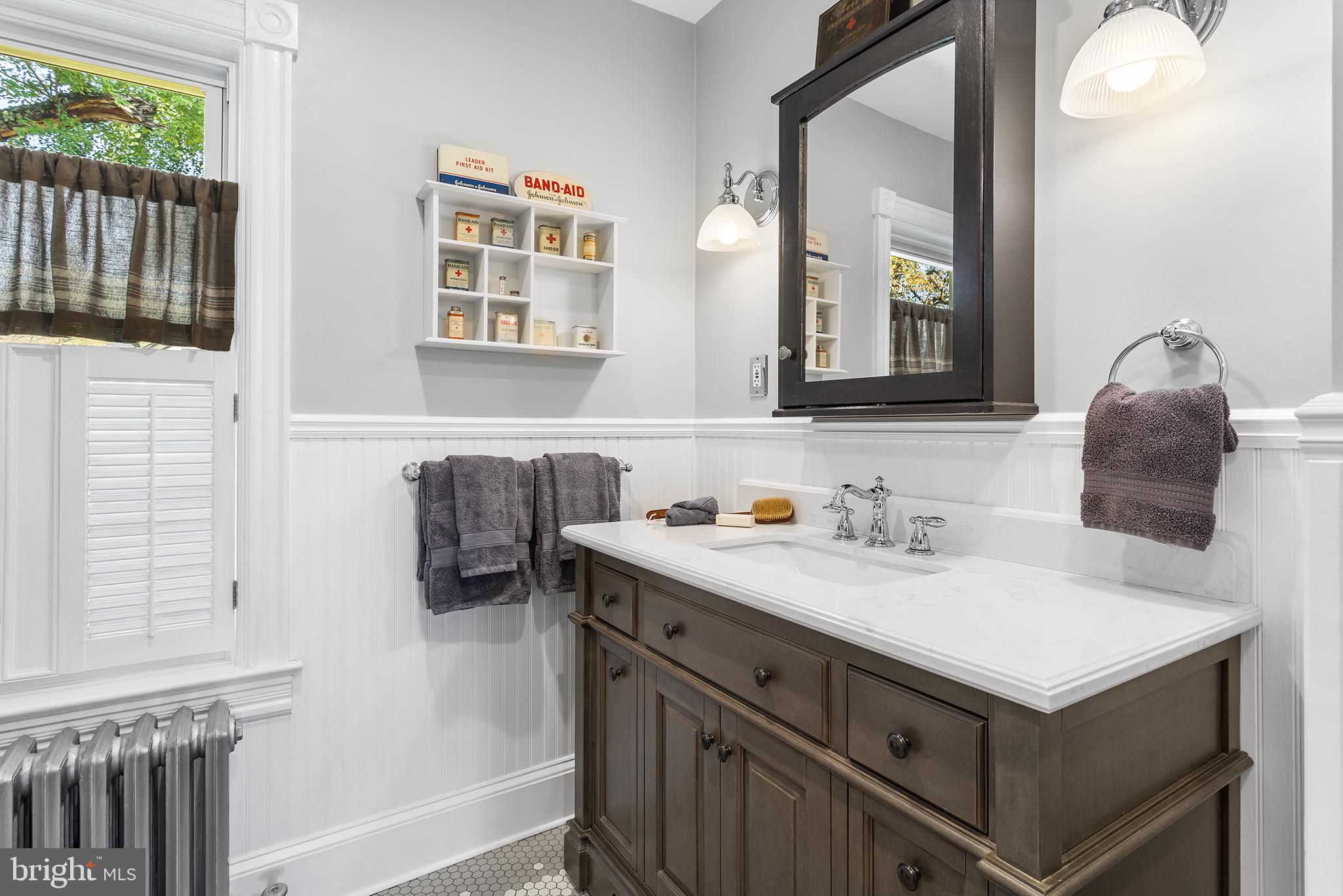 960 Lawrence Road Lawrenceville, NJ 08648 - Photo 47 of 62 a bathroom with a sink and a mirror