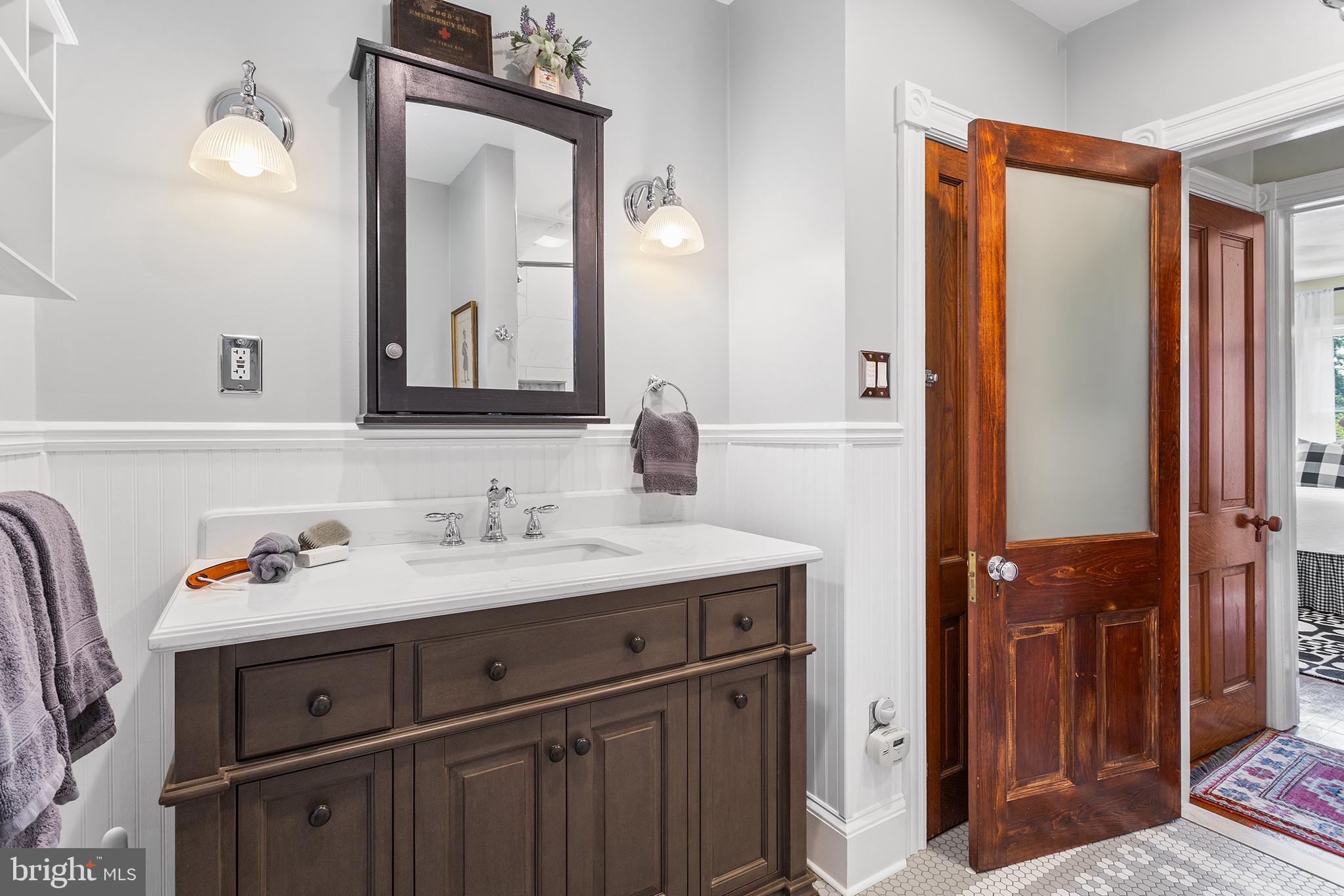 960 Lawrence Road Lawrenceville, NJ 08648 - Photo 48 of 62 a bathroom with a sink vanity and a mirror