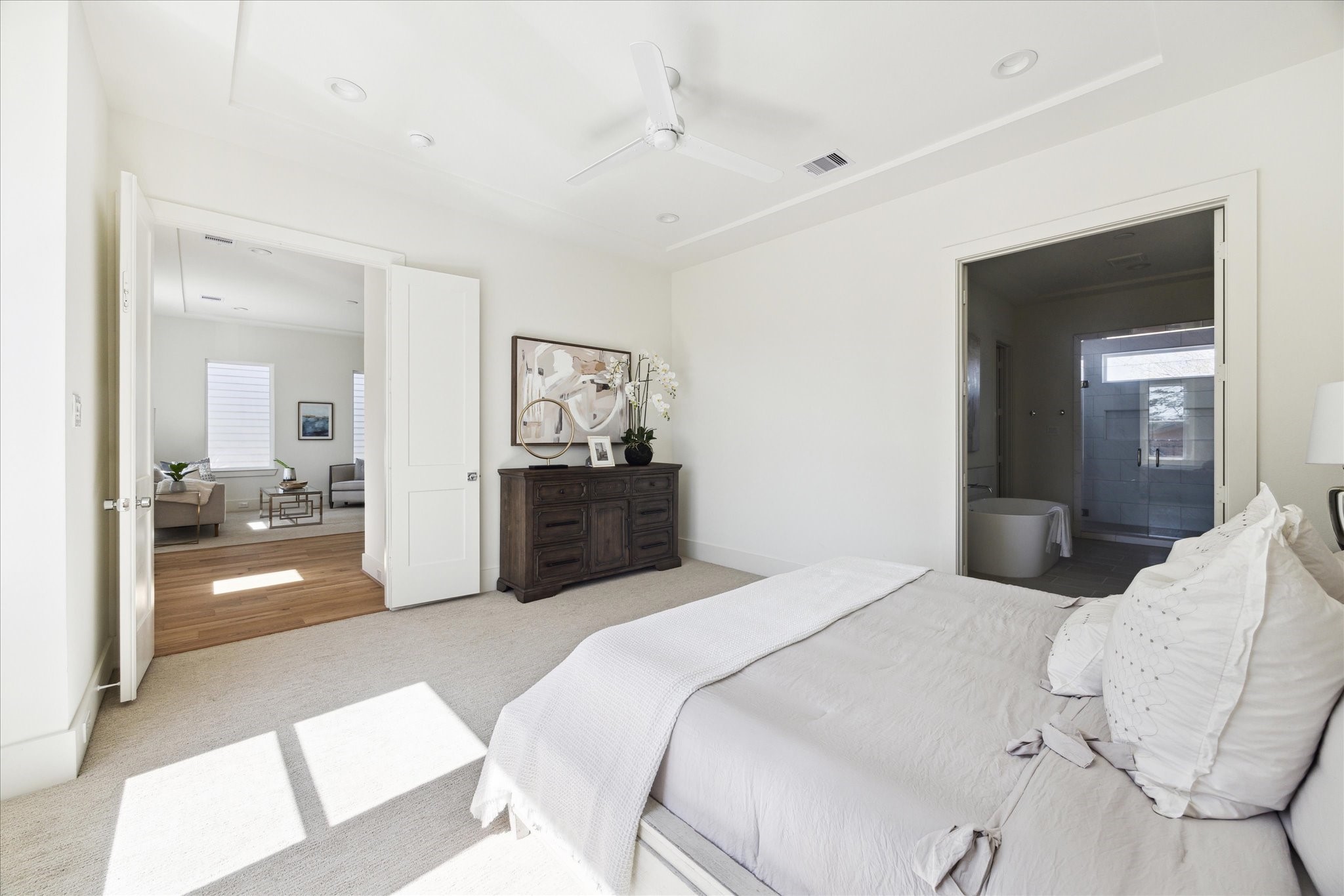 5309 Lambeth Riverside Drive Houston, TX 77091 - Photo 21 of 29 a bedroom with a bed and a chandelier