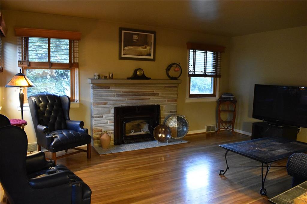 201 Brown Road Wexford, PA 15090 - Photo 8 of 25 Living room with beautiful hardwood and wood burning fireplace with electric blower.