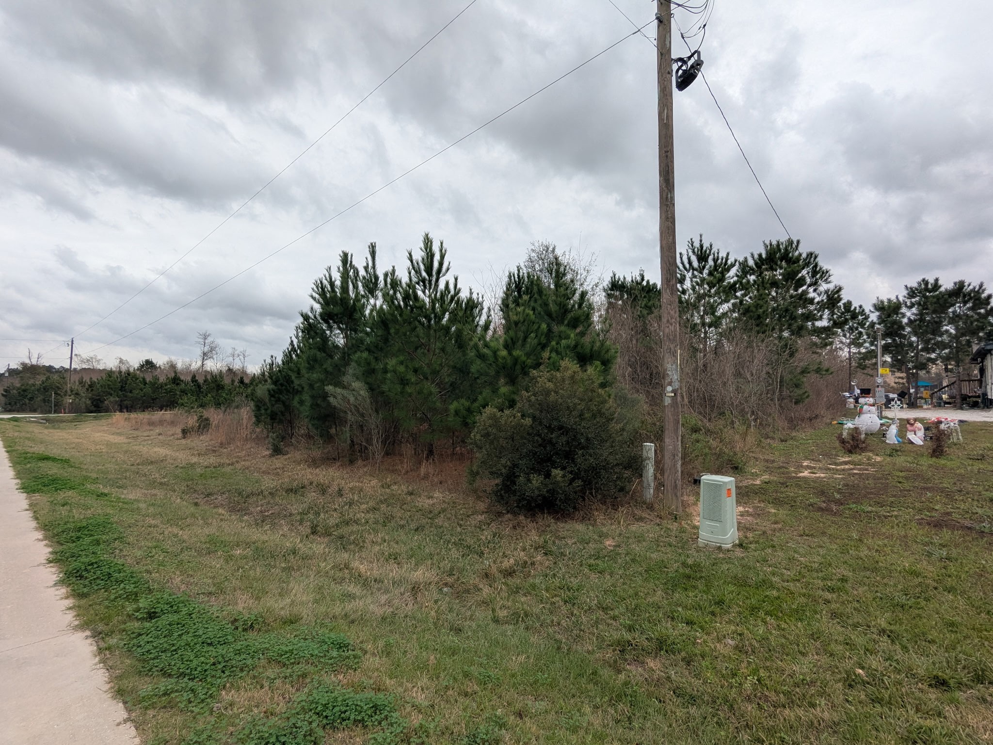 107 County Road 5022 Cleveland, TX 77327 - Photo 2 of 3 a view of a lake with a big yard