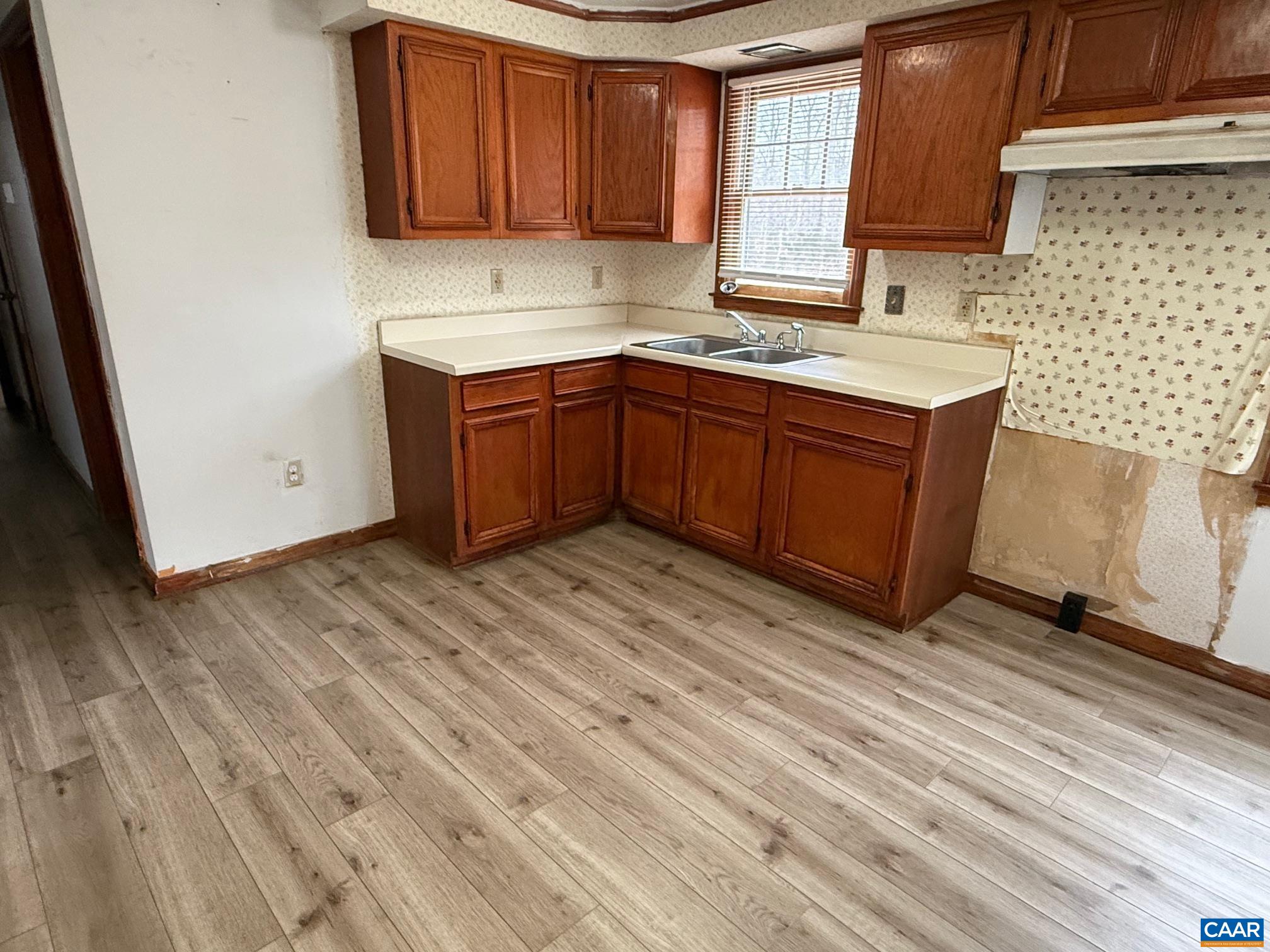 2375 Earlysville Road Earlysville, VA 22936 - Photo 13 of 38 a kitchen with a sink a window and cabinets