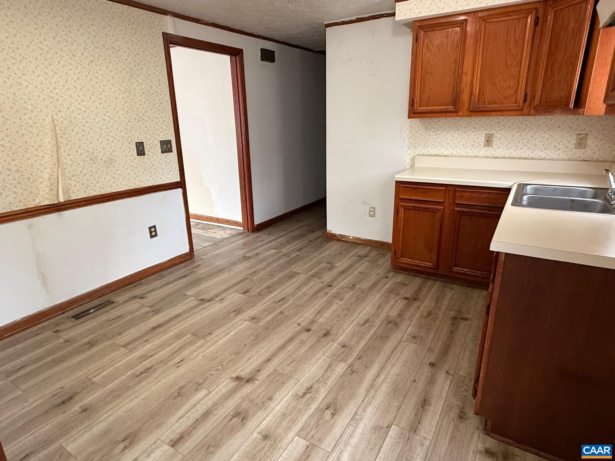 2375 Earlysville Road Earlysville, VA 22936 - Photo 14 of 38 a view of a kitchen with fridge and wooden floor