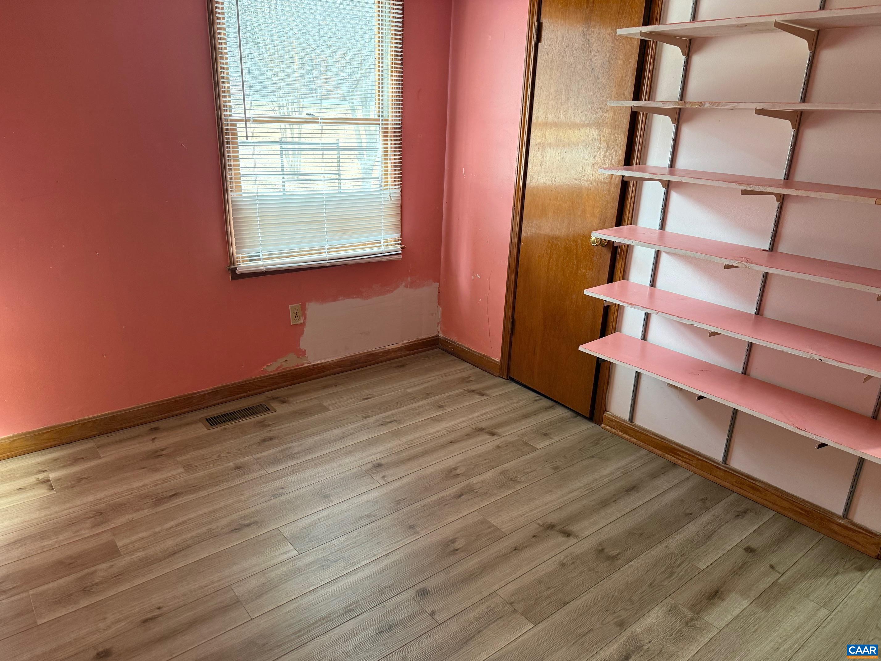 2375 Earlysville Road Earlysville, VA 22936 - Photo 19 of 38 a view of an empty room with wooden floor and a window