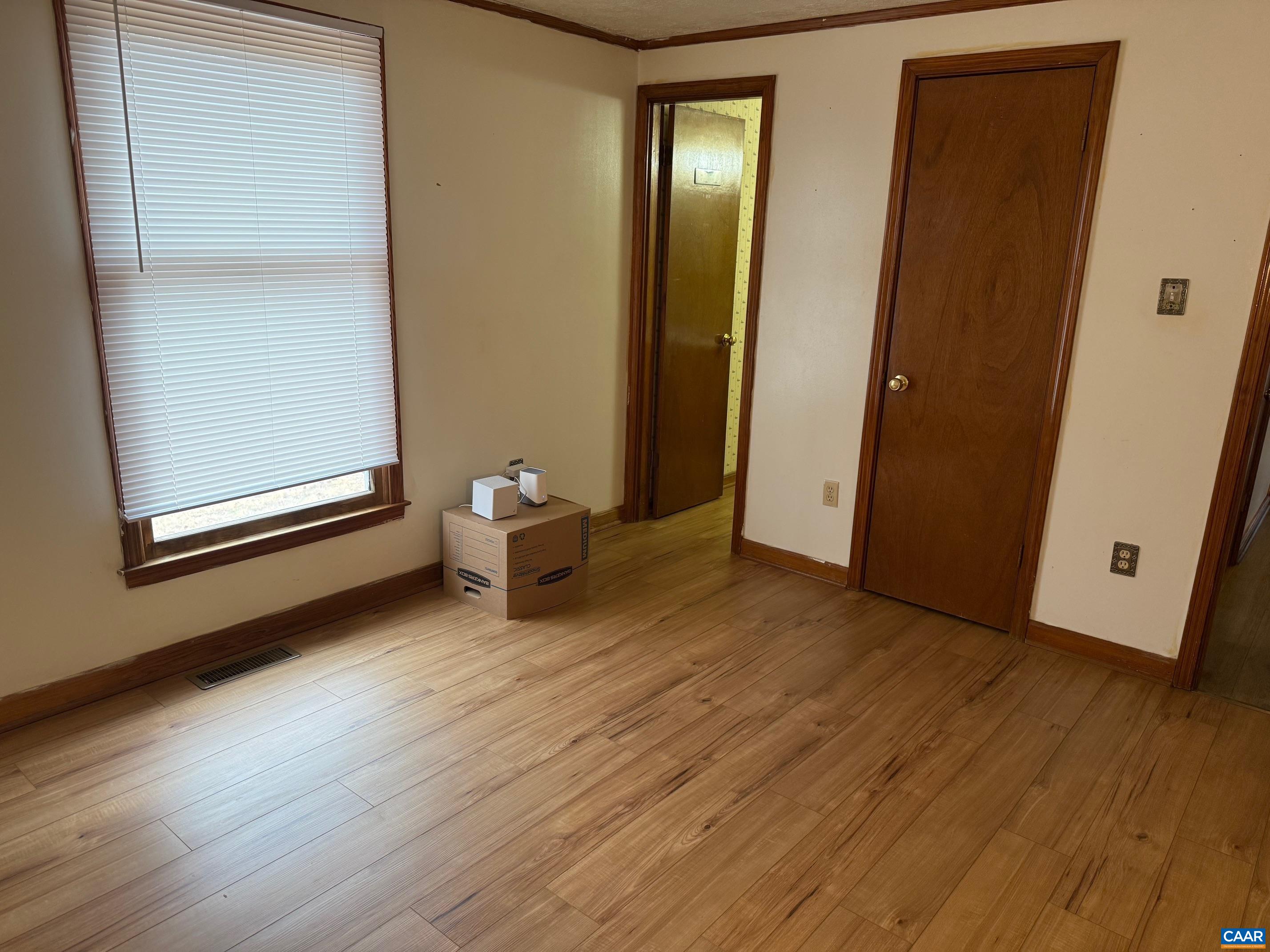 2375 Earlysville Road Earlysville, VA 22936 - Photo 21 of 38 an empty room with wooden floor and windows