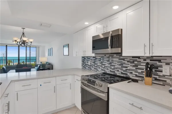 a kitchen with a stove and a microwave