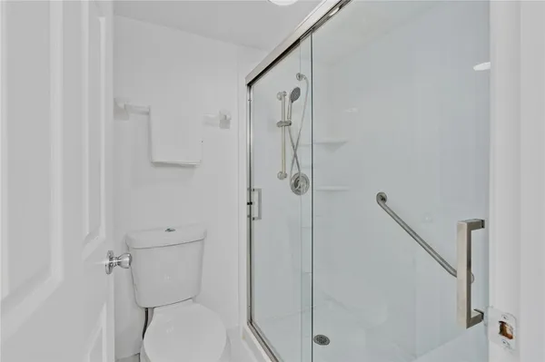 a bedroom with a bed a table and chair