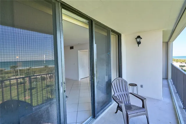 a view of a balcony with door
