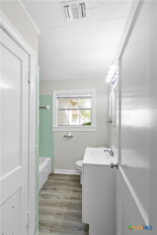 606 West Gayle Street Edna, TX 77957 - Photo 11 of 20 a bathroom with a sink and a mirror