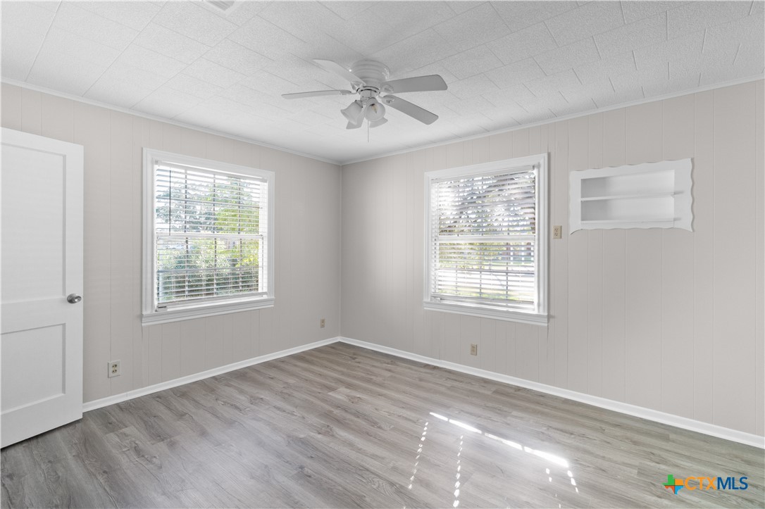 606 West Gayle Street Edna, TX 77957 - Photo 12 of 20 a view of an empty room with a window