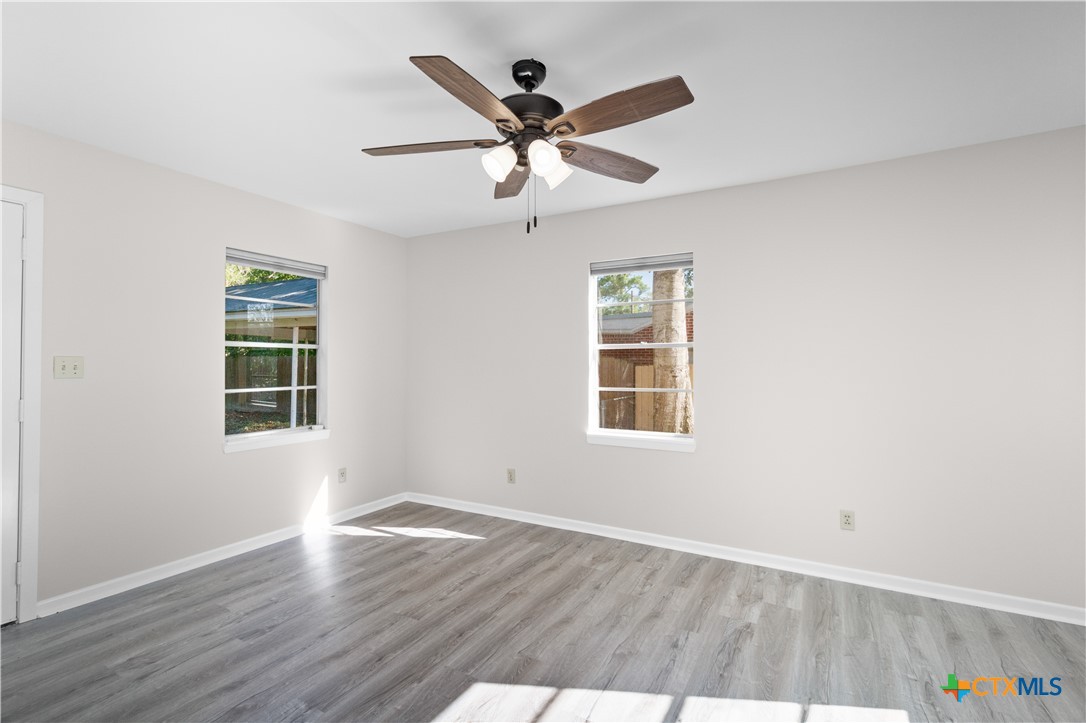 606 West Gayle Street Edna, TX 77957 - Photo 15 of 20 an a window in an empty room