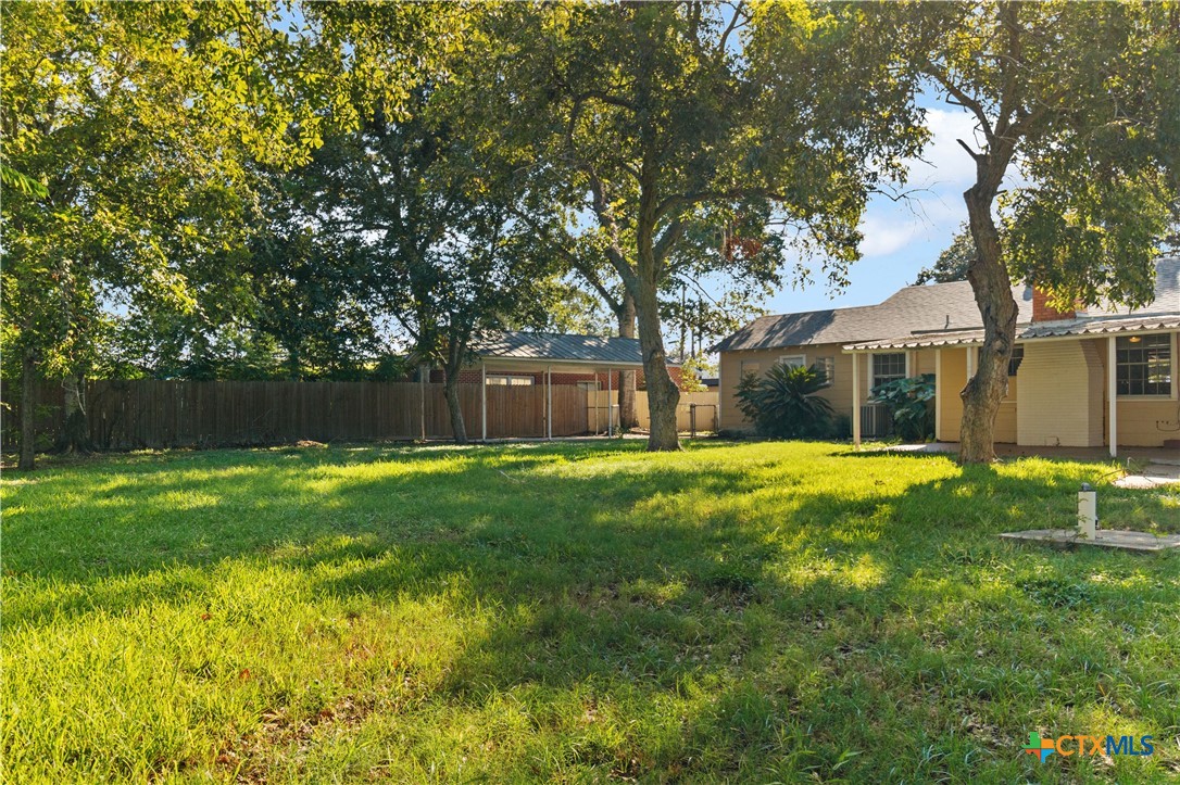 606 West Gayle Street Edna, TX 77957 - Photo 19 of 20 a view of a house with a yard