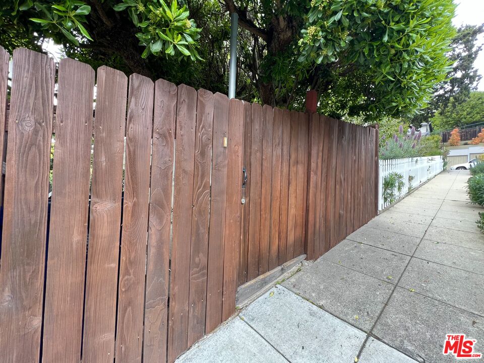 a view of a wooden fence