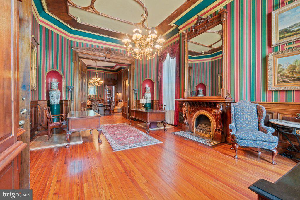 a living room filled with furniture and a fireplace