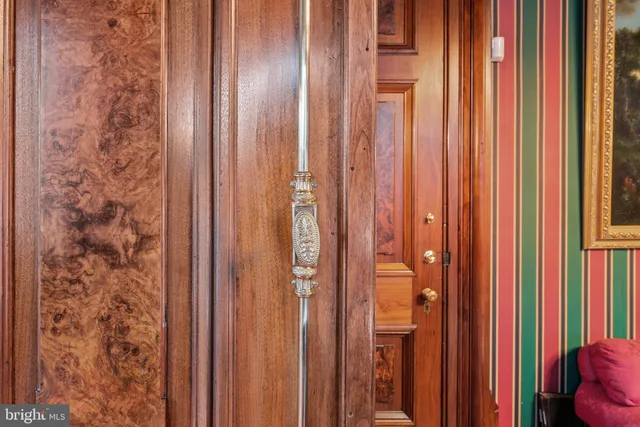 a close view of a sink and a window with wooden floor