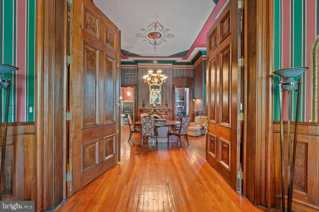 a very nice looking room with a large window and wooden floor