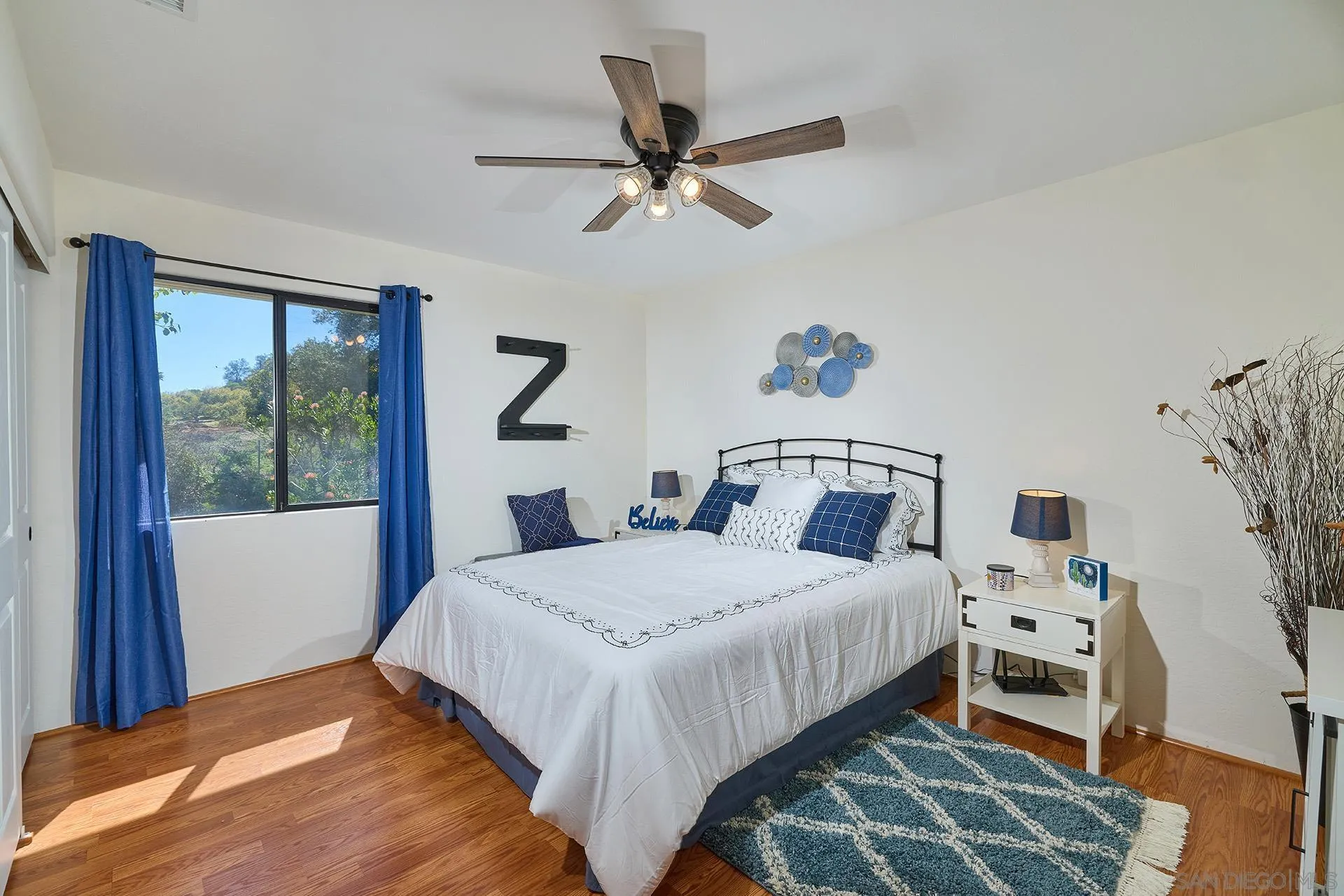 13588 McNally Road Valley Center, CA 92082 - Photo 30 of 43 a bedroom with a bed and a window
