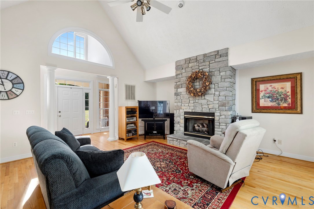 15441 Goshen Road Montpelier, VA 23192 - Photo 13 of 47 a living room with furniture a flat screen tv and a fireplace