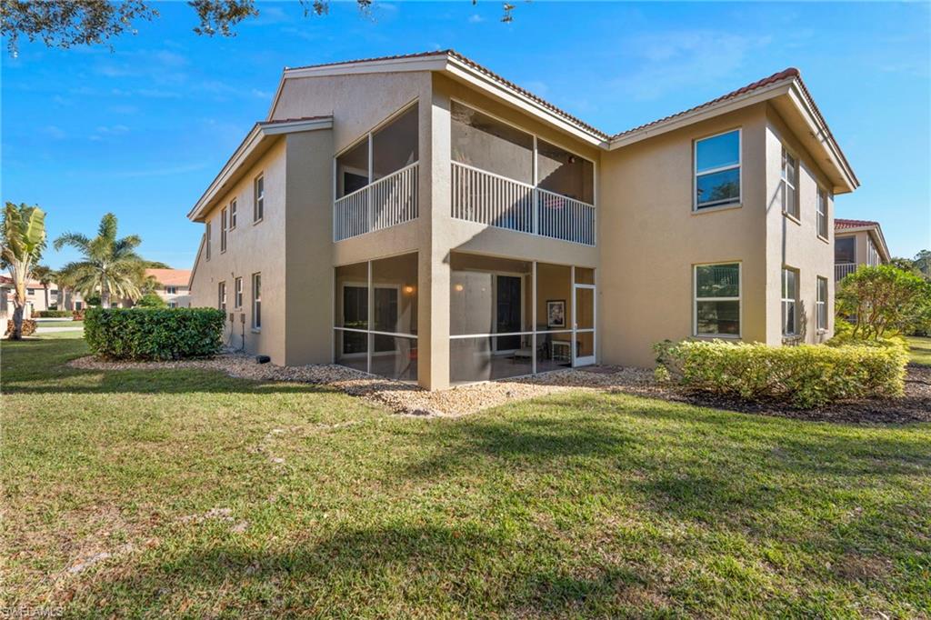 6765 Huntington Lakes Circle, Unit 102 Naples, FL 34119 - Photo 3 of 22 Expanse of Lawn and Landscaped Area beyond Lanai affords Privacy