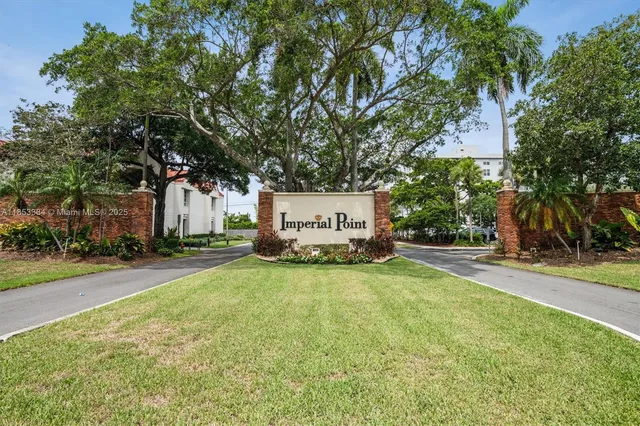 a view of a house with a yard and tree s