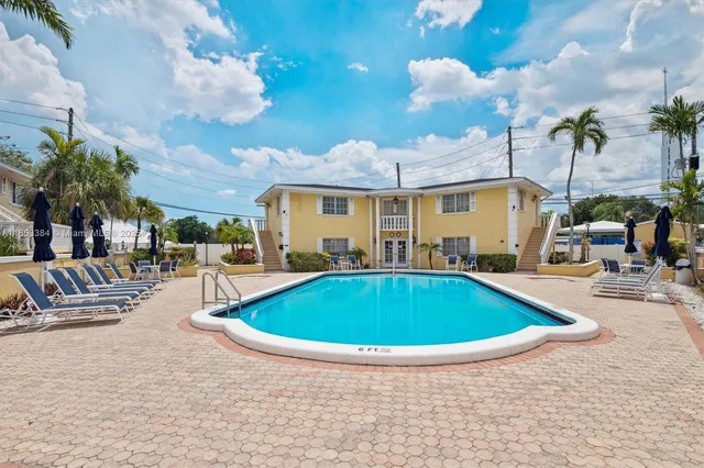 a view of a swimming pool with a patio