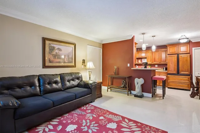 a living room with furniture a dining table and chairs