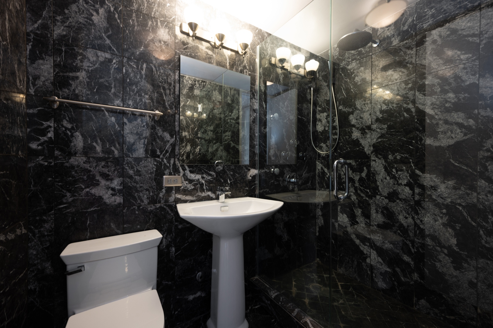 655 West Irving Park Road, Unit 2008 Chicago, IL 60613 - Photo 5 of 19 a bathroom with a sink toilet and a mirror