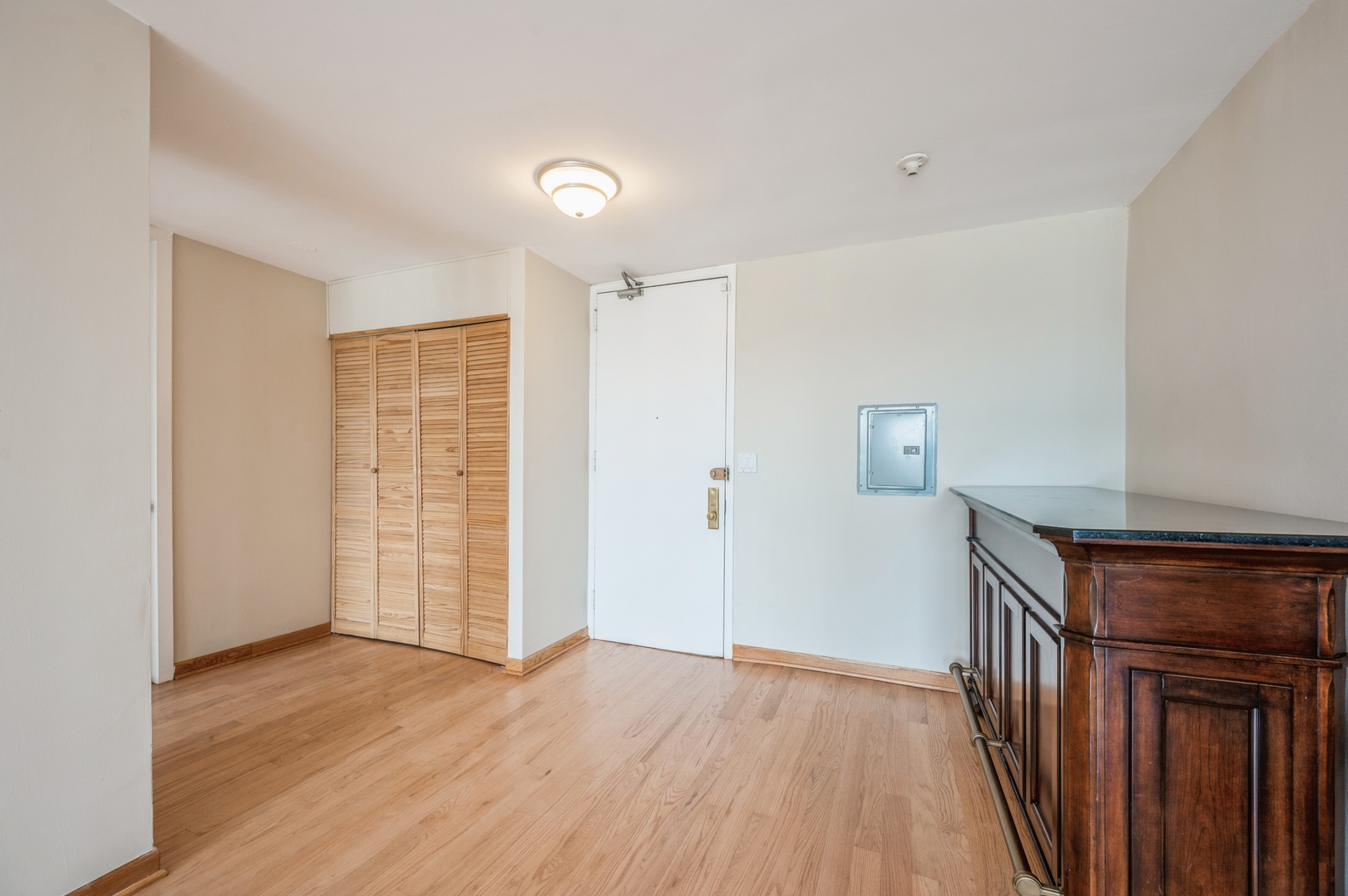 655 West Irving Park Road, Unit 2008 Chicago, IL 60613 - Photo 10 of 19 wooden floor in an empty room with a window
