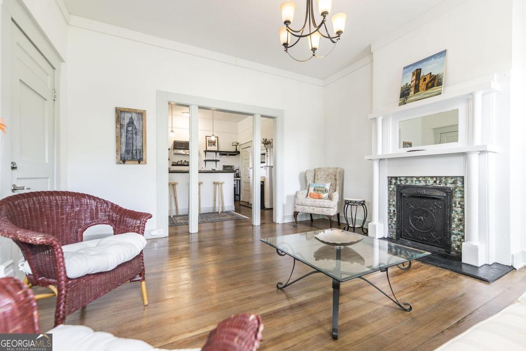 1475 3rd Street Macon, GA 31201 - Photo 11 of 37 a living room with furniture or couch and a fireplace