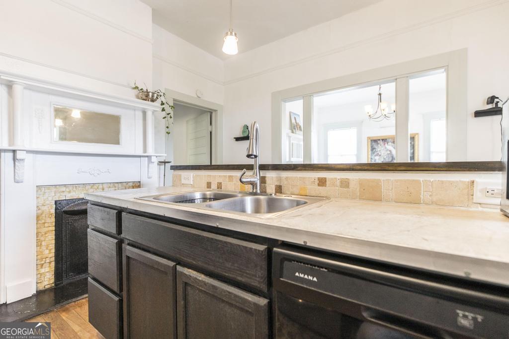 1475 3rd Street Macon, GA 31201 - Photo 18 of 37 a view with granite countertop a sink and a window