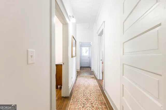 a view of a bathroom from a hallway