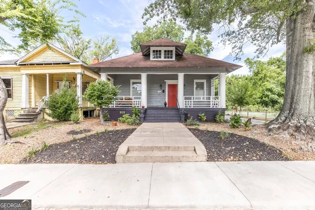 a front view of a house with yard