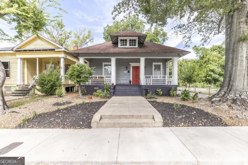 1475 3rd Street Macon, GA 31201 - Photo 2 of 37 a front view of a house with yard