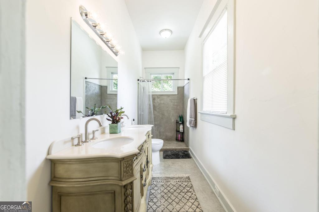 1475 3rd Street Macon, GA 31201 - Photo 24 of 37 a bathroom with a sink and a mirror