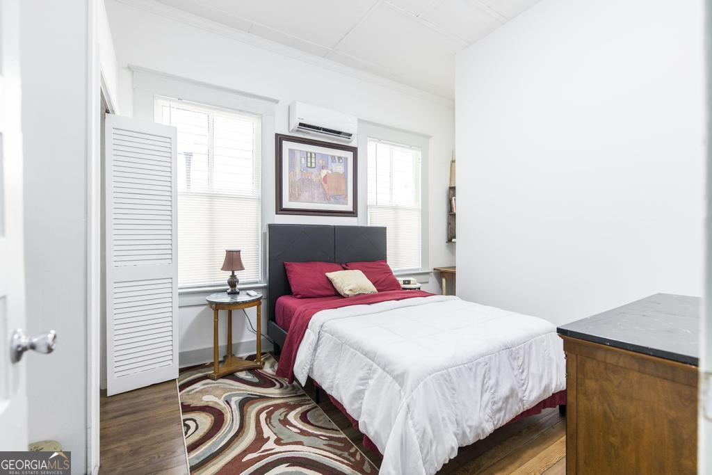 1475 3rd Street Macon, GA 31201 - Photo 26 of 37 a bedroom with a bed and a window