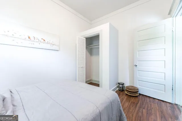 a bedroom with a bed and cabinets