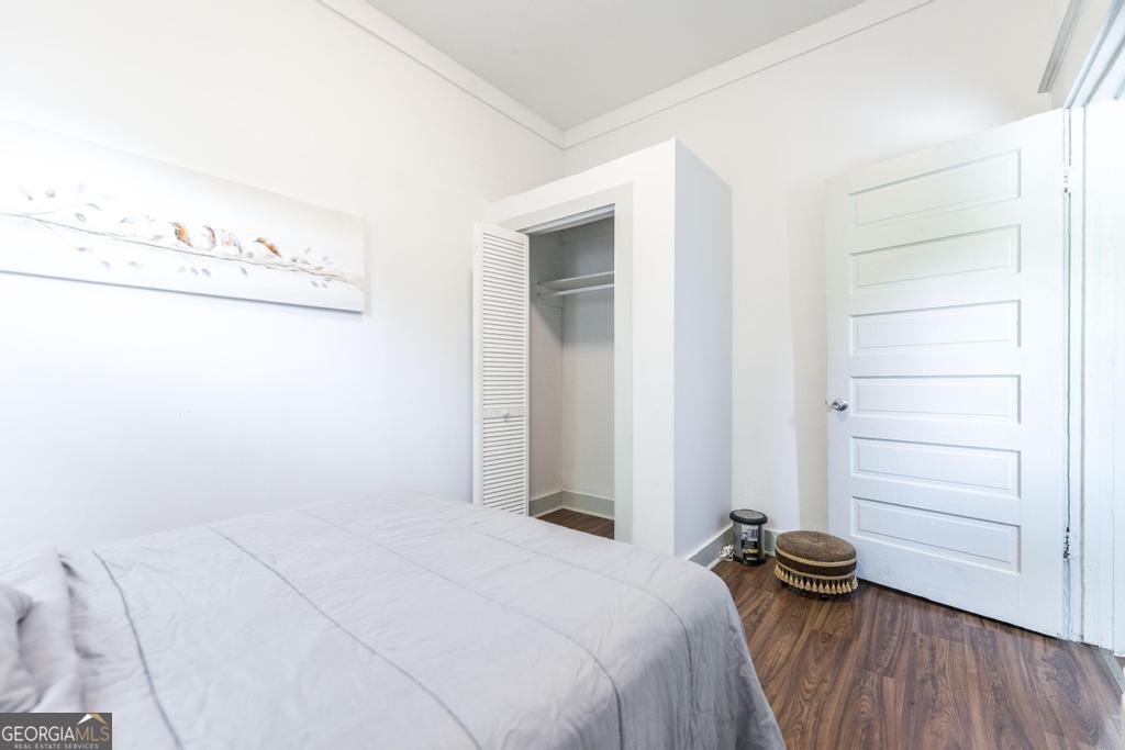 1475 3rd Street Macon, GA 31201 - Photo 28 of 37 a bedroom with a bed and cabinets