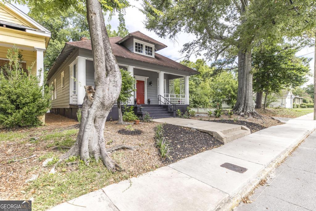 1475 3rd Street Macon, GA 31201 - Photo 3 of 37 a front view of a house with garden