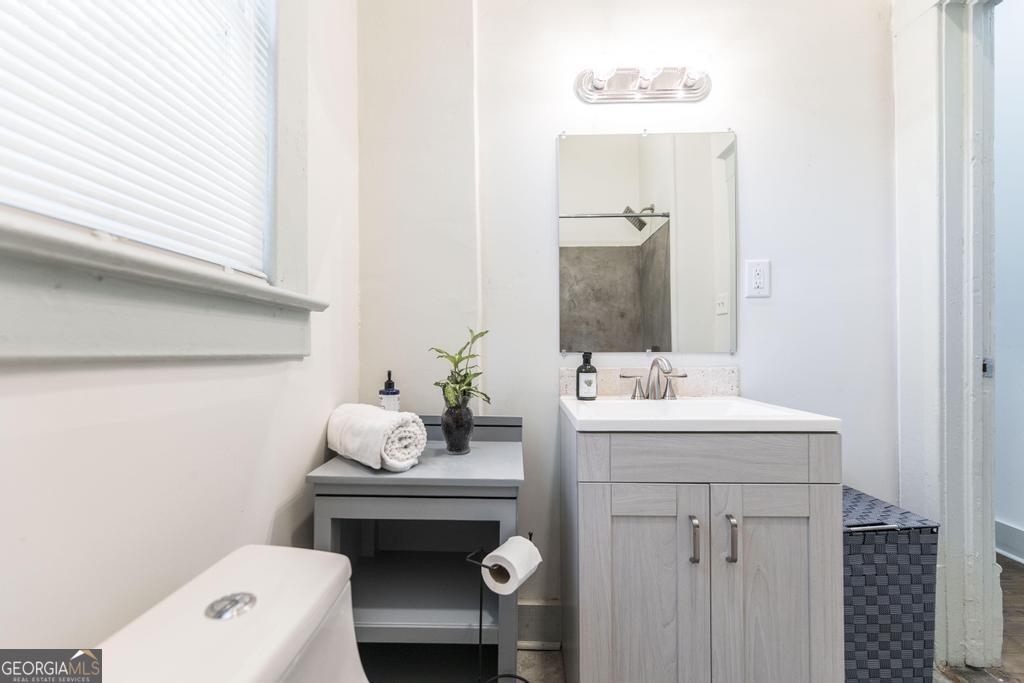 1475 3rd Street Macon, GA 31201 - Photo 31 of 37 a bathroom with a sink toilet and vanity