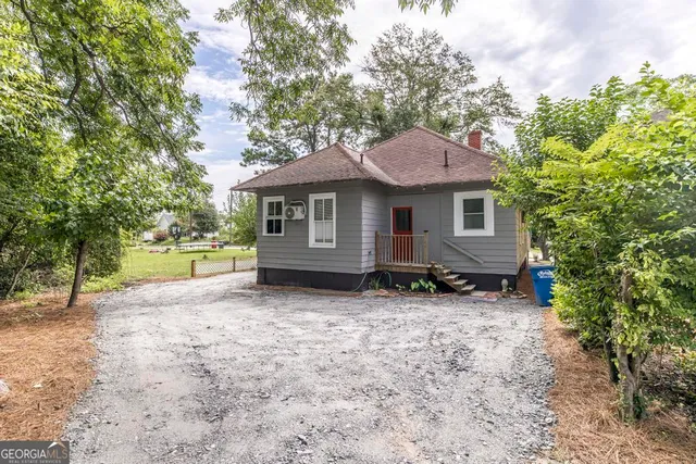 a house with trees in the background