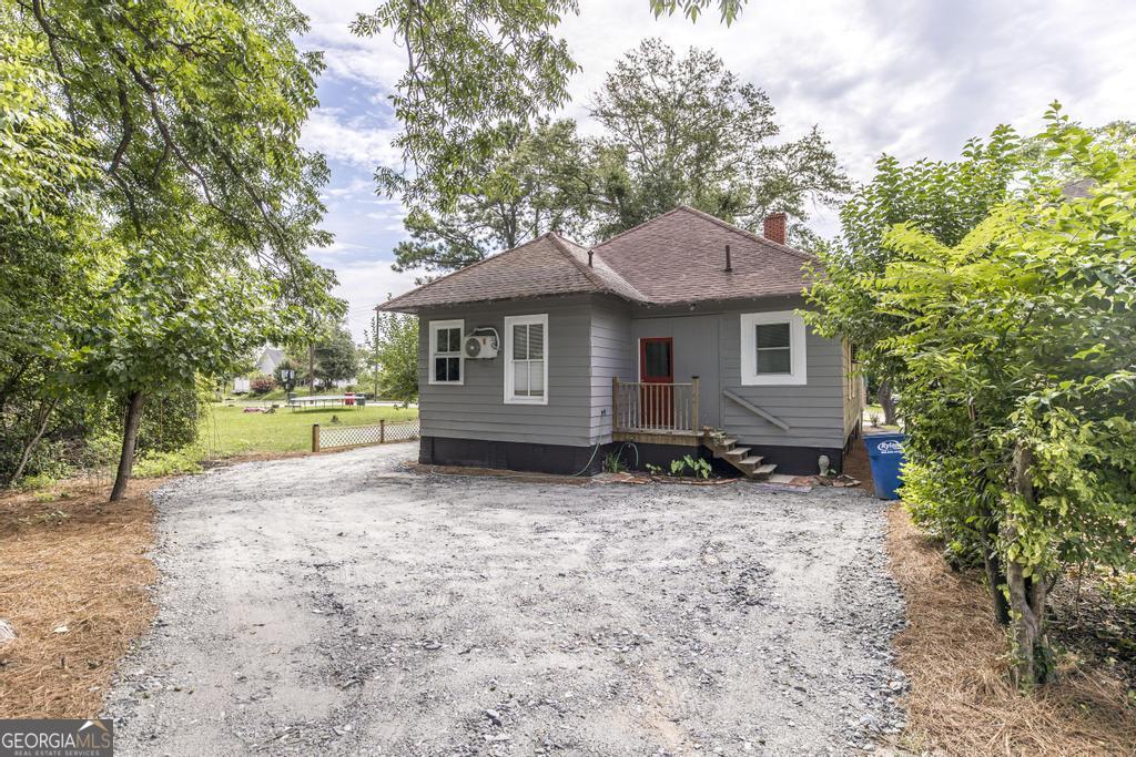 1475 3rd Street Macon, GA 31201 - Photo 37 of 37 a house with trees in the background