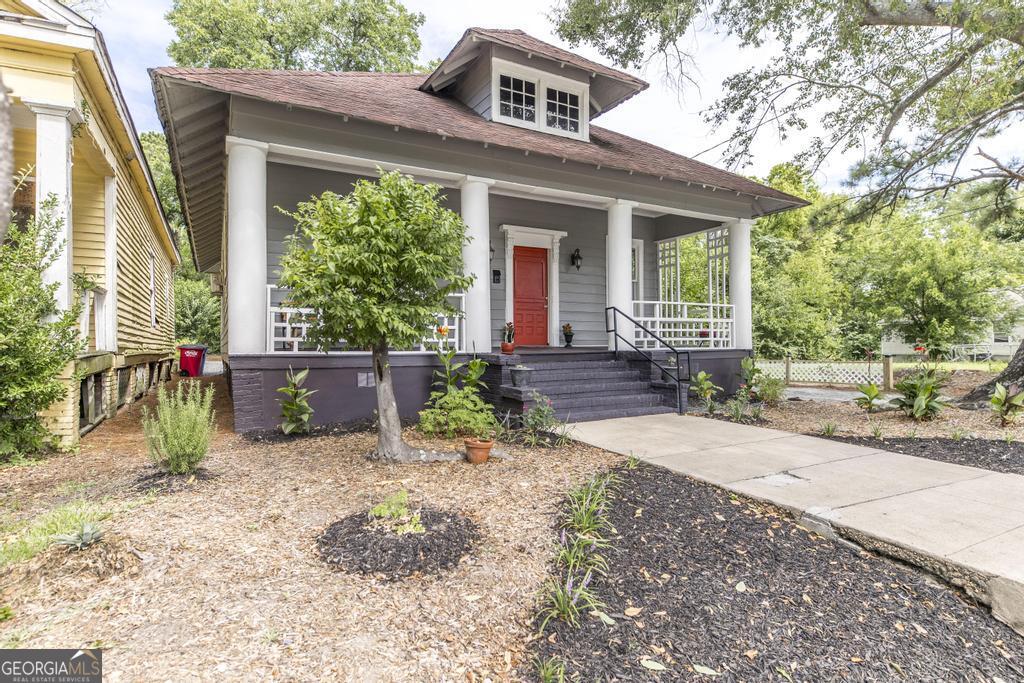 1475 3rd Street Macon, GA 31201 - Photo 5 of 37 a front view of a house with garden
